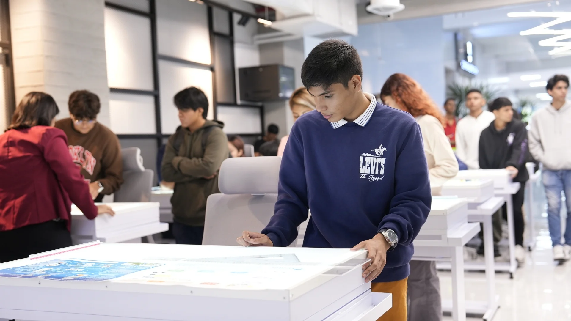 ECOTEC student working on a laptop on campus